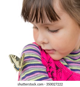 Child and butterfly. Portrait of preschooler girl with papilio machaon