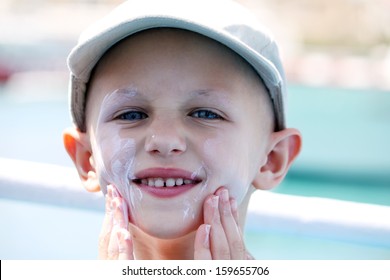 Child With Cancer Applies Sun Cream On Her Face 