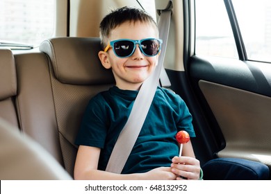 Child In The Car With  Fasten Seat Belt 