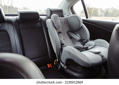 Child car seat for safety in the rear passenger seat of a car. - Shutterstock ID 2230012869