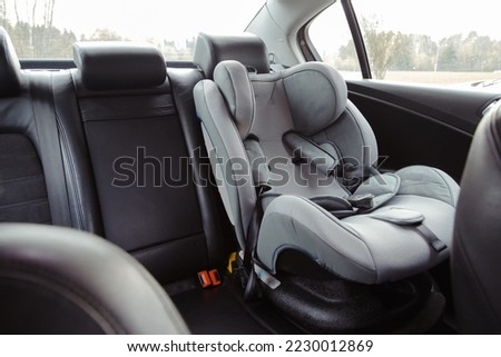 Child car seat for safety in the rear passenger seat of a car. Foto stock © 