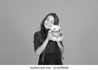 Child Care. Emotional Intellect. Lovely Child. Childhood Concept. Lovely Small Girl Smiling Happy Face Hold Toy. Happy Childhood. Imaginary Friend. Little Girl Play With Soft Toy Teddy Bear