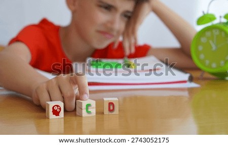 child with CD frustrated doing homework, importance of educational needs and special attention to this disorder.
