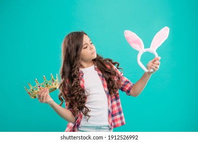 Child Choose Between Crown And Bunny Ears. Selfish Teenager Girl. Easter Bunny Hunt. Being Egoistic. Ready For Party. Happy Childhood. Egoist Kid Hold Crown. Happy Easter Holiday.