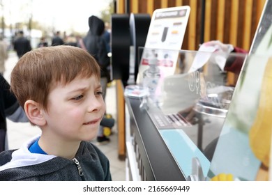 Child Choosing Ice Cream In Cafe In Park