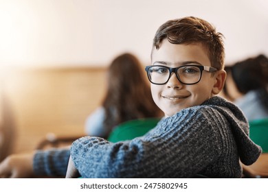 Child, classroom and portrait of face with glasses for education, learning and development in junior school. Boy, smile and knowledge in academy for subject, growth and happiness for information - Powered by Shutterstock