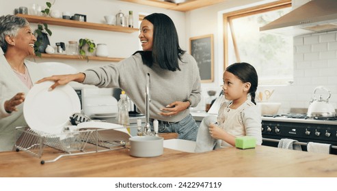 Child cleaning the kitchen with her grandmother and mother while bonding, talking and laughing. Happy, smile and girl kid washing the dishes with her young mom and senior woman in their family home. - Powered by Shutterstock