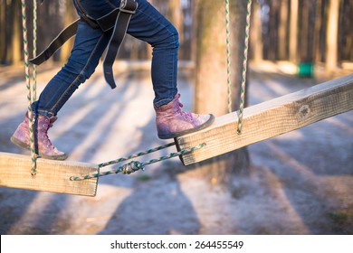 Child Climbing On High Rope Park