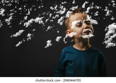 Child Closed His Eyes And Dreams Of Not Looking At Camera Isolated On Blank Gray Studio Background, Young Boy Posing For Portrait.