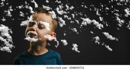 Child Closed His Eyes And Dreams Of Not Looking At Camera Isolated On Blank Gray Studio Background, Young Boy Posing For Portrait.