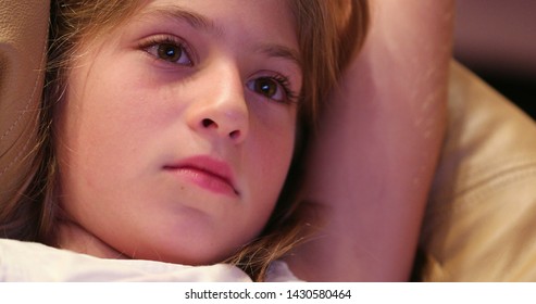 Child Closeup Face Expression Watching Movie Screen Learning About Story