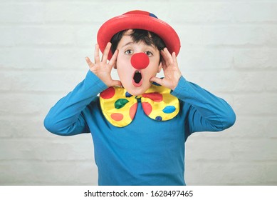 Child With Clown Nose And Hat In Carnival