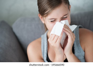 Child cold flu illness tissue blowing runny nose