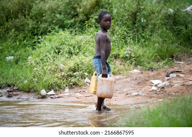 A Child Collecting Water From Lake In Uganda On 08.03.17