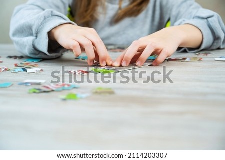 Similar – Baby Mädchen spielt mit Haarspangen, die auf dem Boden sitzen.