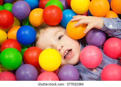 child, colored balls, the game