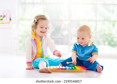 Child With Colorful Music Instruments. Art For Kids. Little Girl With Flute, Xylophone, Maracas And Tambourine. Early Development For Children. Creative Kid. Kindergarten Or Preschool Arts Class.