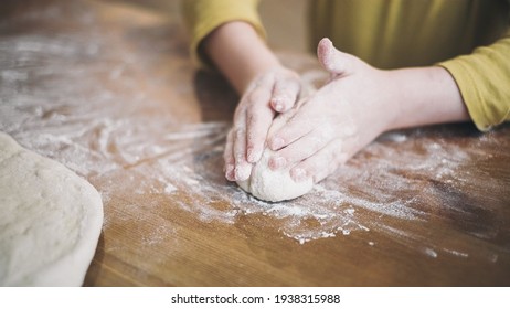 Child cooking on kitchen baking food with parents - Powered by Shutterstock