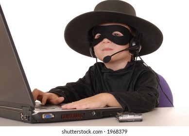 Child as costumed Zorro at laptop helpdesk