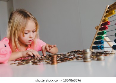 Child Counting Coins, Cute Girl Saving Money