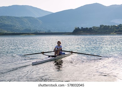 Child in the course of rowing on single