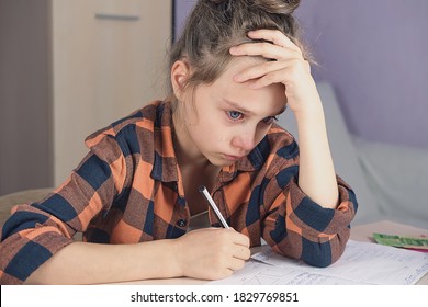 little girl crying doing homework