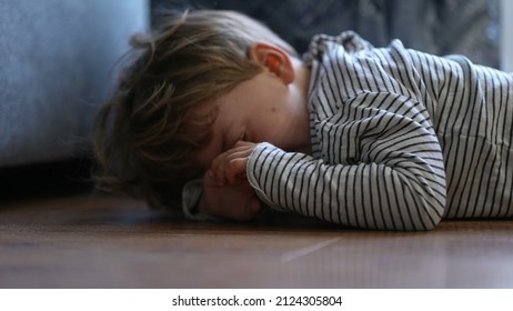 Child Crying On Floor Having Tantrum Little Boy Cries