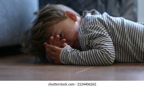 Child Crying On Floor Having Tantrum Little Boy Cries