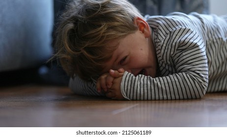 Child Crying On Floor Having Tantrum Little Boy Cries