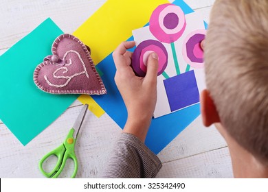 Child Cut Out Of Colored Paper. Kid Making  Birthday Card. Happy Mothers Day And Happy 8 March. Kids Art, Art Projects, Handmade New Year Decorations 