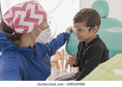 A Child With A Dentist In A Dental Office. Dental Treatment In A Children's Clinic.
