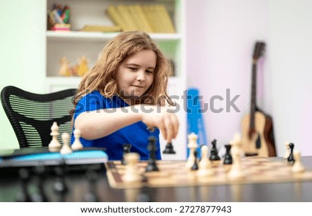 Child development concept. Board logic game for child. Teenager playing chess logic game. Smart kid playing chess. Clever kid thinking about chess. Clever child thinking about chess.