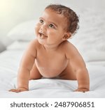 Child development, cute and smile with baby on bed in home for growth, having fun or playing. Adorable, balance and innocent with happy newborn infant learning to crawl in bedroom of apartment