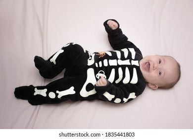 child disguised as a skeleton for halloween party