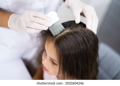 Child Doctor Checking Head Hair For Lice