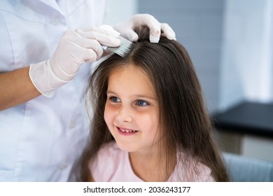 Child Doctor Checking Head Hair For Lice