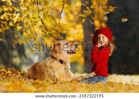 Similar – Foto Bild fröhliches Kind Mädchen mit einem Korb voller Äpfel, das mit ihrem Hund spielt.