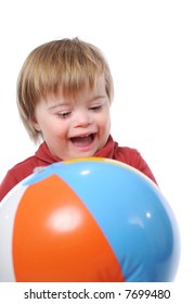 Child With Down Syndrome Playing With A Ball