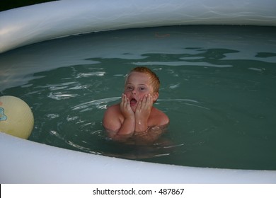 Child With Down Syndrome In A Pool