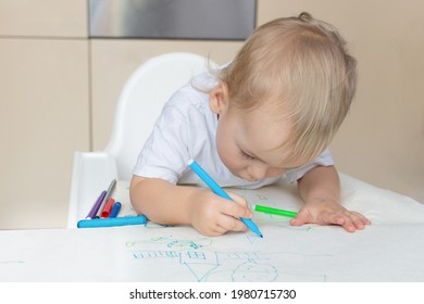 Child Draw With Felt-tip Pens, Playing At Home Sits At A Kid's Table In The Kitchen. Todler With Educational Toys For Creativity. Boy Play At Home.