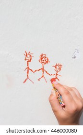 Child Drawing On The Wall