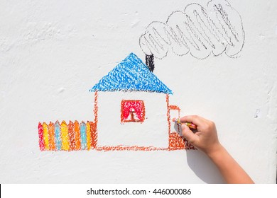 Child Drawing On The Wall