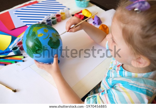Child drawing pattern of paints fun smile on the balloon. Fun toy. Arts  crafts concept. art learning and education