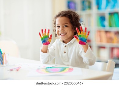 Child drawing rainbow 