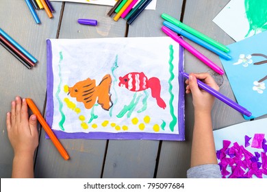 Child Drawing. Top View Of Child Hands With Pencil Painting Picture On Paper. Kid Drawings