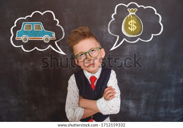 Child
dreams about car. Boy thinking about money and
car.