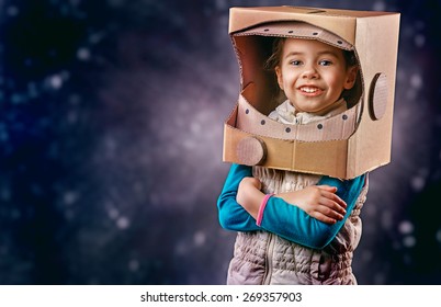 Child Is Dressed In An Astronaut Costume