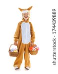 Child dressed as easter hare with basket eggs and flowers isolated over white background