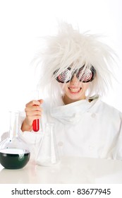 Child Dressed As A Mad Scientist Performing An Experiment With Beakers And Colorful Fluid.