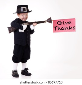 child dressed as Pilgrim and giving thanks